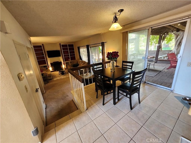 dining room with a healthy amount of sunlight and a textured ceiling