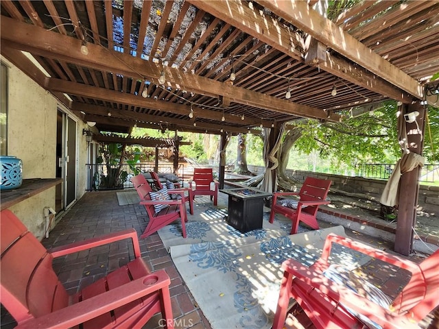 view of patio / terrace featuring an outdoor fire pit and a pergola