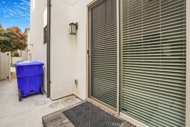 property entrance featuring stucco siding