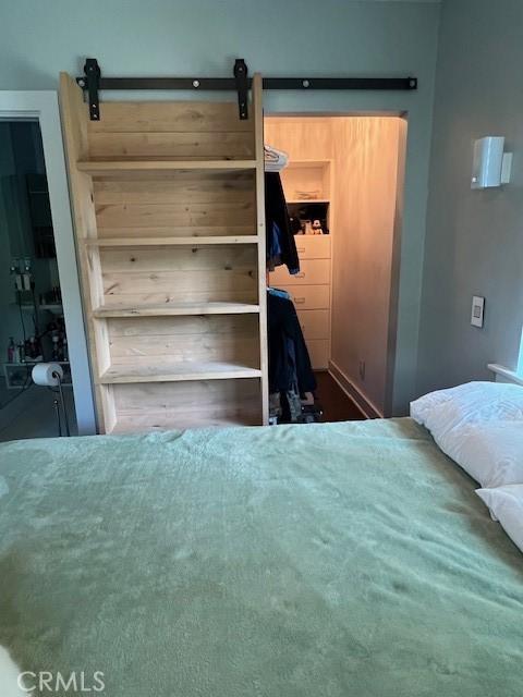 bedroom with a barn door