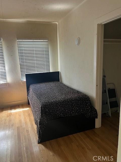 bedroom featuring wood-type flooring