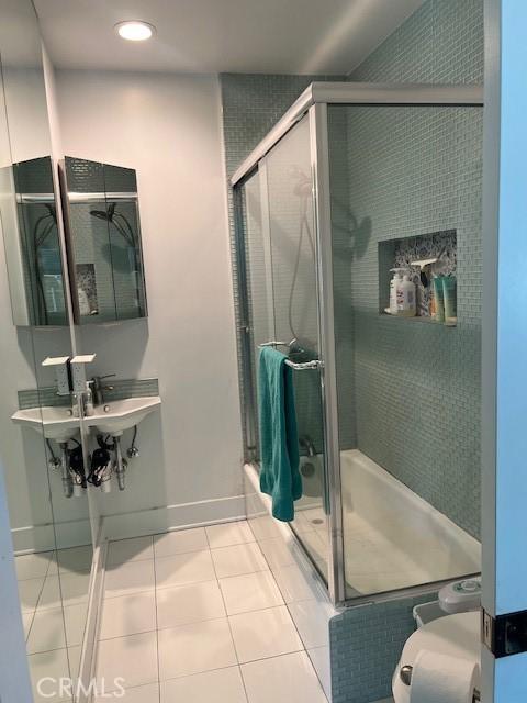 full bath featuring tile patterned flooring, toilet, recessed lighting, and a stall shower