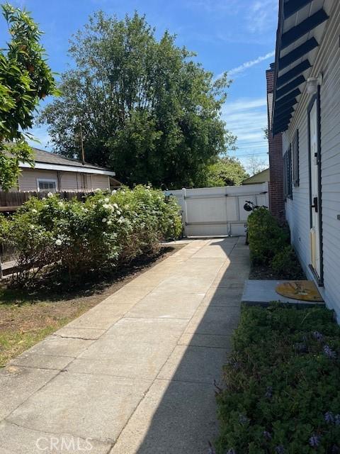 view of yard featuring fence and a gate