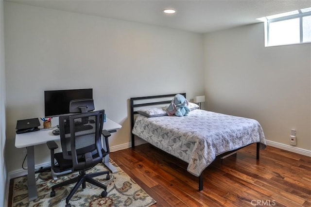 bedroom with recessed lighting, baseboards, and wood finished floors