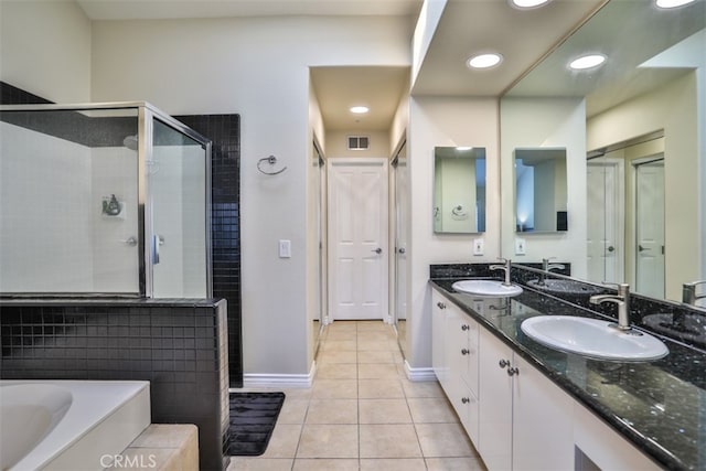 5 Arese Aisle, Irvine, CA 92606 - full bathroom featuring a stall shower, tile patterned floors, double vanity, a bath, and baseboards