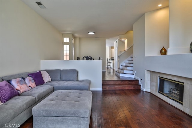 5 Arese Aisle, Irvine, CA 92606 - living area with dark wood finished floors, a fireplace, stairs, and baseboards