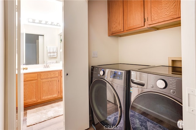 28751 Broadstone Way, Menifee, CA 92584 - washroom featuring cabinet space, separate washer and dryer, and wood finished floors