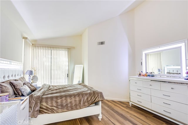 28751 Broadstone Way, Menifee, CA 92584 - bedroom featuring lofted ceiling, light wood-style flooring, baseboards, and access to exterior