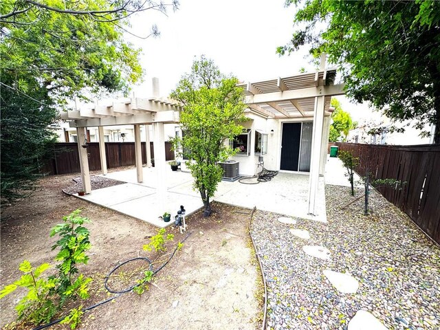 28751 Broadstone Way, Menifee, CA 92584 - back of house with a pergola, a patio, central air condition unit, and a fenced backyard
