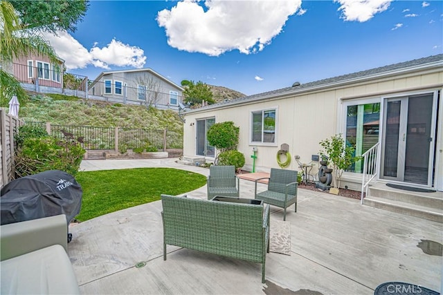 view of patio / terrace with entry steps, an outdoor hangout area, and fence