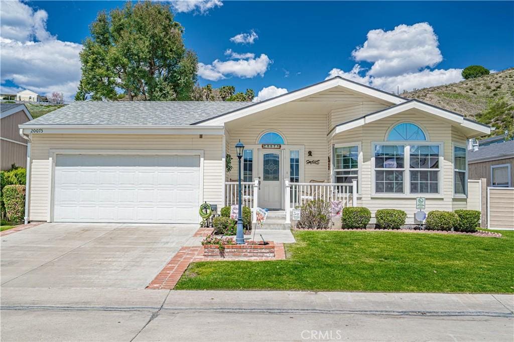 20075 Crestview Dr, Canyon Country, CA 91351 - ranch-style home featuring a front lawn, a garage, and driveway