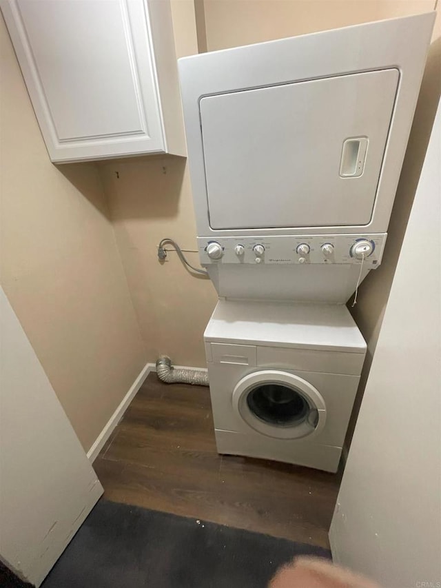 1726 Belle Meade Rd, Encinitas, CA 92024 - washroom featuring stacked washing machine and dryer, cabinet space, wood finished floors, and baseboards