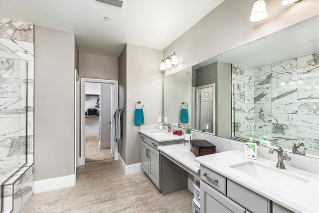 30580 Hawkscrest Rd, Murrieta, CA 92563 - full bath with tiled shower, vanity, baseboards, and wood finished floors