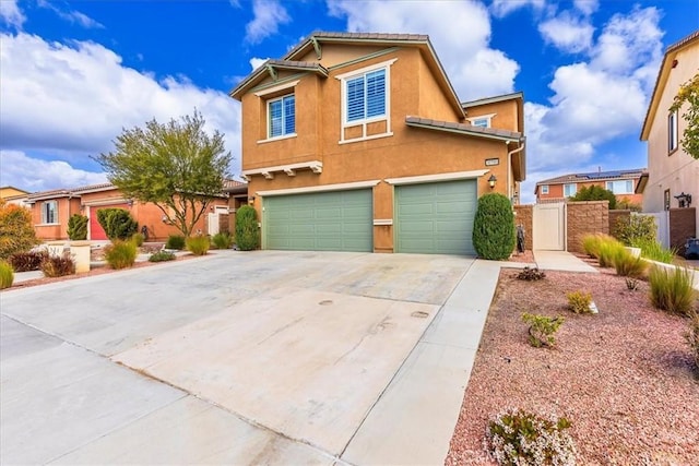 30580 Hawkscrest Rd, Murrieta, CA 92563 - traditional-style home with a garage, stucco siding, driveway, and a gate