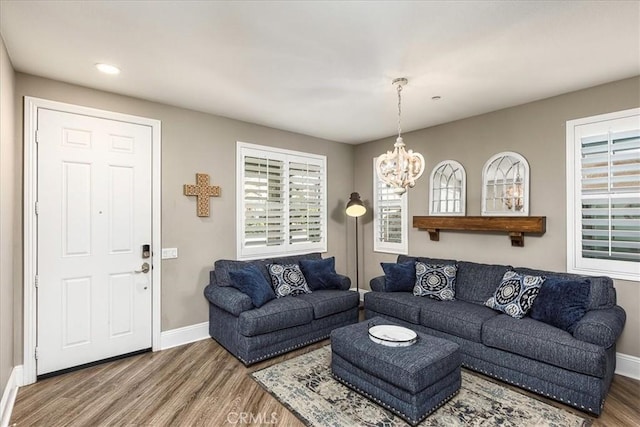 30580 Hawkscrest Rd, Murrieta, CA 92563 - living room with wood finished floors, an inviting chandelier, baseboards, and recessed lighting