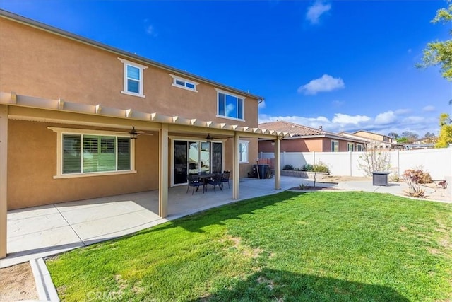 30580 Hawkscrest Rd, Murrieta, CA 92563 - back of property featuring ceiling fan, a yard, stucco siding, a patio area, and fence