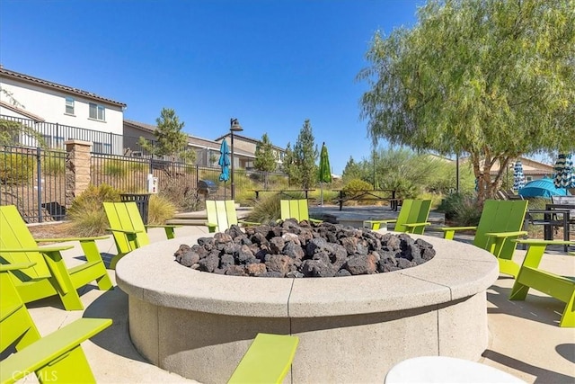 30580 Hawkscrest Rd, Murrieta, CA 92563 - surrounding community with a fire pit, a patio, and fence