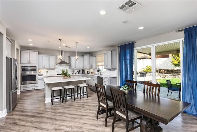 30580 Hawkscrest Rd, Murrieta, CA 92563 - dining room with visible vents, recessed lighting, and light wood finished floors