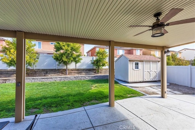 30580 Hawkscrest Rd, Murrieta, CA 92563 - view of patio / terrace with a fenced backyard, a storage shed, an outbuilding, and ceiling fan