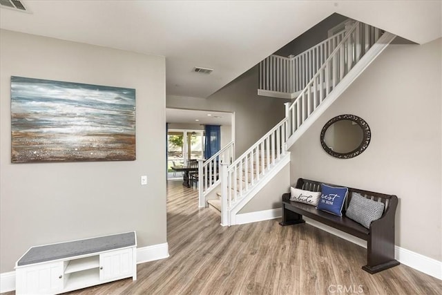30580 Hawkscrest Rd, Murrieta, CA 92563 - entrance foyer with stairs, visible vents, baseboards, and wood finished floors