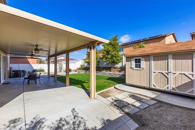 30580 Hawkscrest Rd, Murrieta, CA 92563 - view of patio / terrace with a fenced backyard, a ceiling fan, an outdoor structure, a storage unit, and outdoor dining area