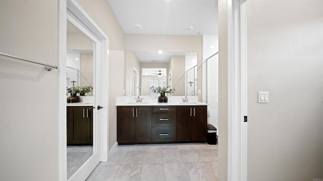 10861 Blake Way, San Diego, CA 92129 - bathroom featuring double vanity, a ceiling fan, a shower with shower door, and tile patterned floors