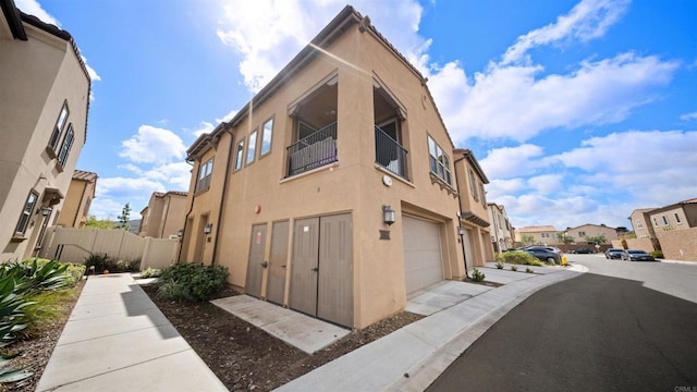 10861 Blake Way, San Diego, CA 92129 - view of building exterior with a garage and a residential view