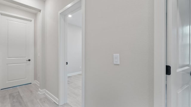 10861 Blake Way, San Diego, CA 92129 - corridor with baseboards and light wood-style floors