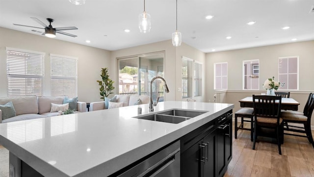 10861 Blake Way, San Diego, CA 92129 - kitchen featuring open floor plan, light wood-style floors, dark cabinetry, light countertops, and ceiling fan