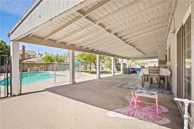 view of patio featuring an outdoor hangout area, a fenced in pool, and fence
