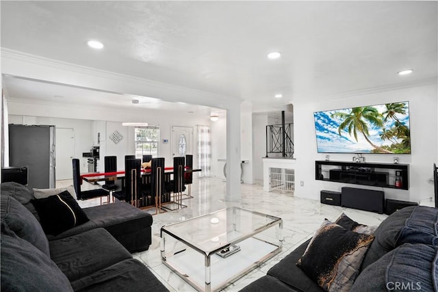 living area with recessed lighting, marble finish floor, and ornamental molding