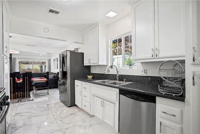 kitchen with a sink, marble finish floor, white cabinets, appliances with stainless steel finishes, and visible vents