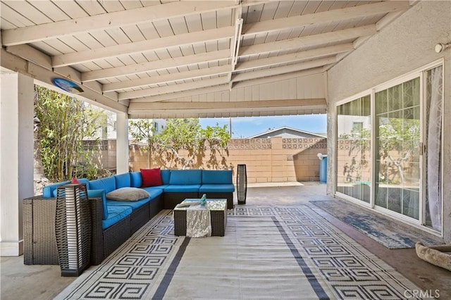 view of patio featuring an outdoor living space and a fenced backyard