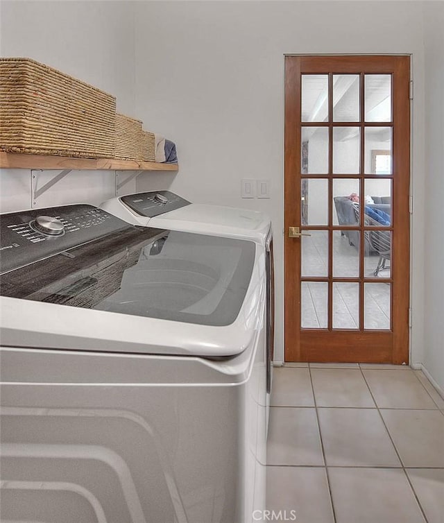 1261 Linda Vista Rd, Palm Springs, CA 92262 - laundry area with independent washer and dryer and light tile patterned floors