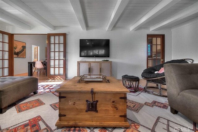 1261 Linda Vista Rd, Palm Springs, CA 92262 - carpeted living room with beam ceiling and french doors