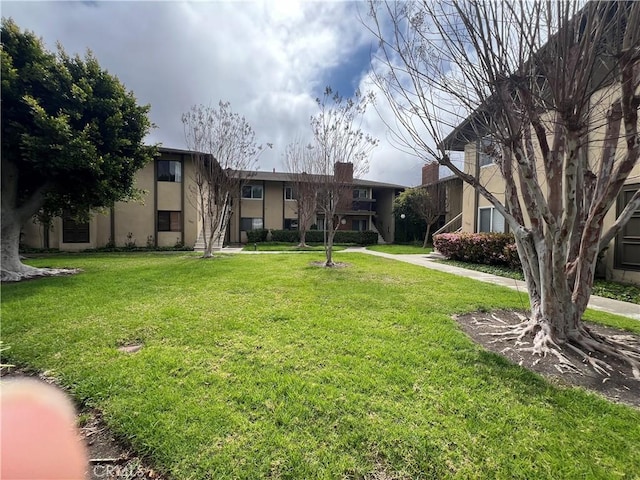 1111 S Coast Dr Unit 18, Costa Mesa, CA 92626 - view of community featuring a yard