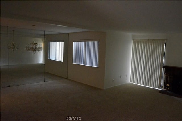 1111 S Coast Dr Unit 18, Costa Mesa, CA 92626 - carpeted empty room featuring a chandelier