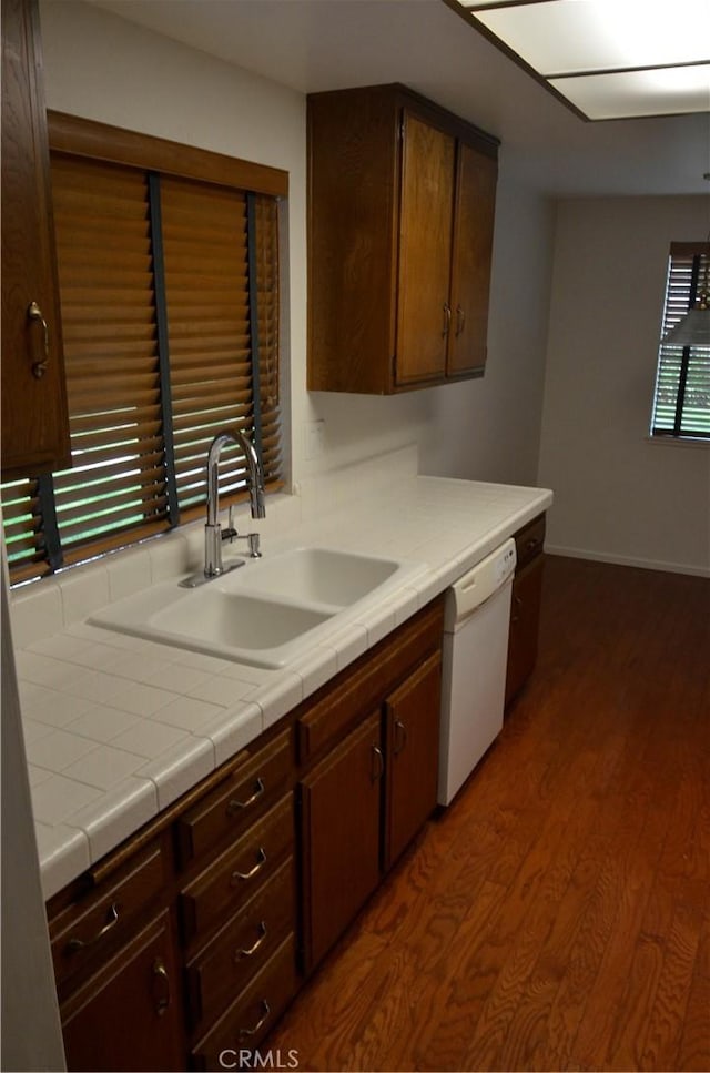 1111 S Coast Dr Unit 18, Costa Mesa, CA 92626 - kitchen with dishwasher, a sink, dark wood-style floors, and dark brown cabinetry