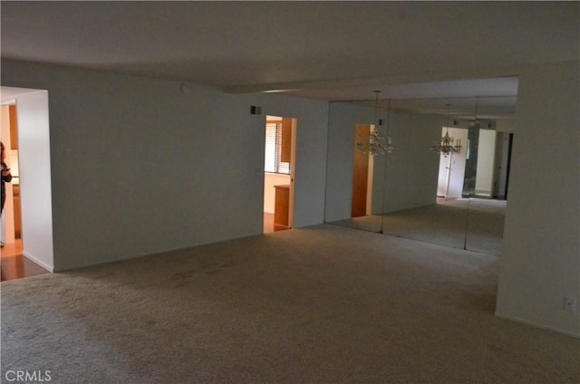 1111 S Coast Dr Unit 18, Costa Mesa, CA 92626 - carpeted spare room featuring a chandelier