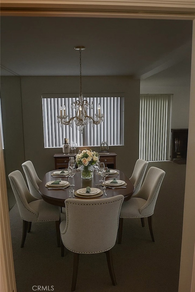 1111 S Coast Dr Unit 18, Costa Mesa, CA 92626 - dining space featuring a chandelier