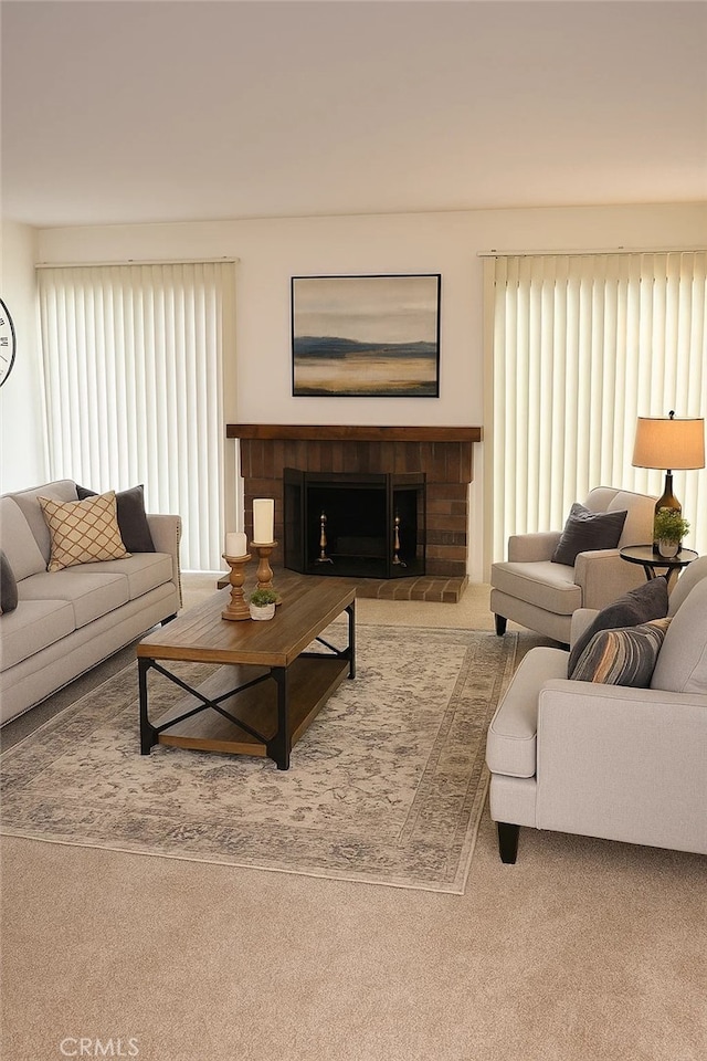 1111 S Coast Dr Unit 18, Costa Mesa, CA 92626 - living room with carpet, plenty of natural light, and a brick fireplace