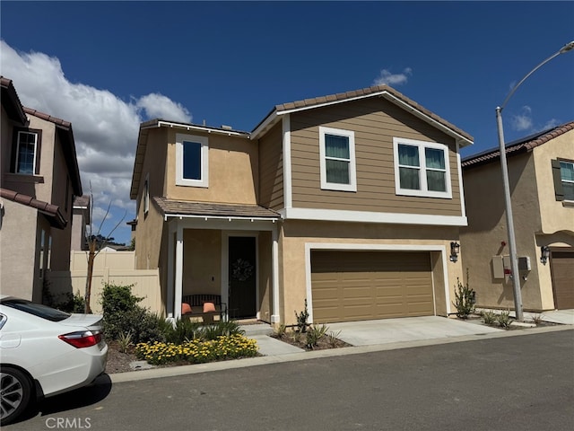 36631 Desert Tortoise Rd, Murrieta, CA 92563 - view of front of house with an attached garage, stucco siding, concrete driveway, and a tiled roof