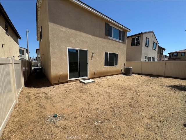 36631 Desert Tortoise Rd, Murrieta, CA 92563 - back of house featuring stucco siding, a fenced backyard, and central AC