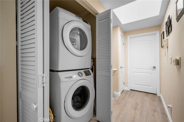 2256 Montrose Ave Unit 14, Montrose, CA 91020 - laundry area with light wood-style flooring, laundry area, stacked washer / drying machine, and baseboards