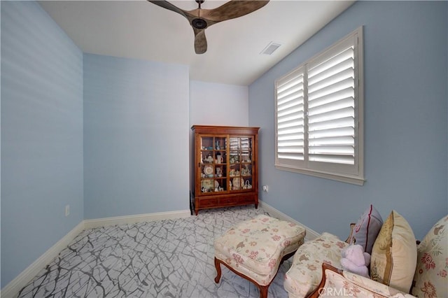 sitting room with visible vents, ceiling fan, and baseboards
