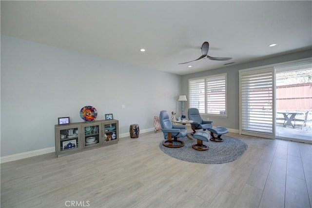living area with recessed lighting, baseboards, a ceiling fan, and wood finished floors