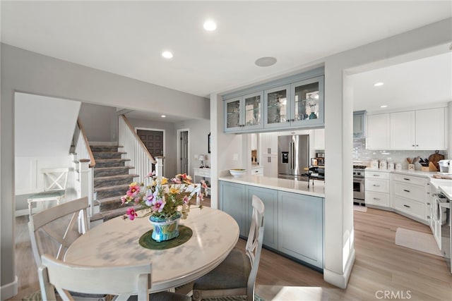 1001 Buena Vis Unit 2, San Clemente, CA 92672 - dining area with stairs, light wood-style flooring, and recessed lighting