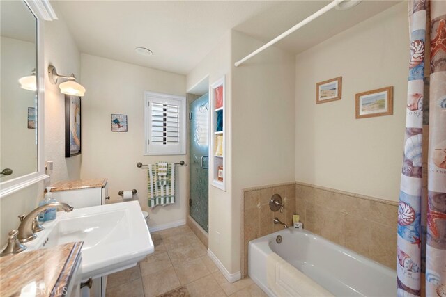 1001 Buena Vis Unit 2, San Clemente, CA 92672 - full bathroom featuring baseboards, a sink, a shower stall, tile patterned flooring, and a garden tub