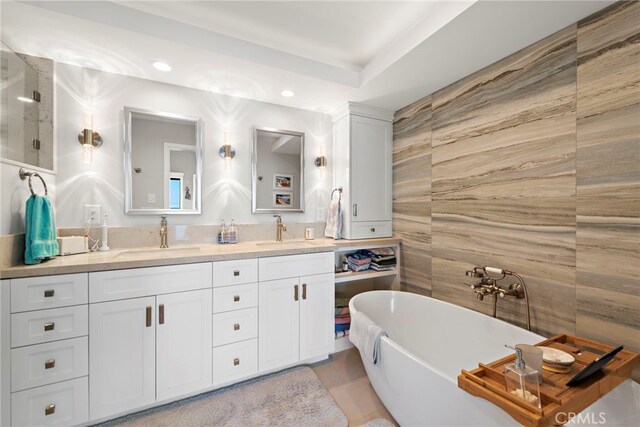 1001 Buena Vis Unit 2, San Clemente, CA 92672 - full bath with a soaking tub, double vanity, tile walls, and a sink