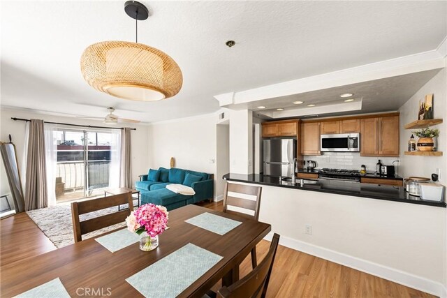 1100 Euclid Ave Unit 103, Long Beach, CA 90804 - dining space featuring light wood-style floors, crown molding, and baseboards